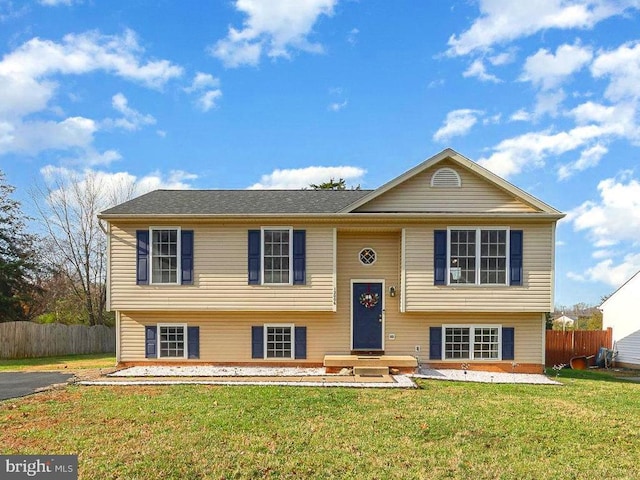 bi-level home with a front yard