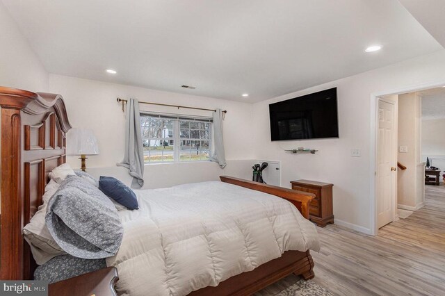 bedroom featuring light hardwood / wood-style floors