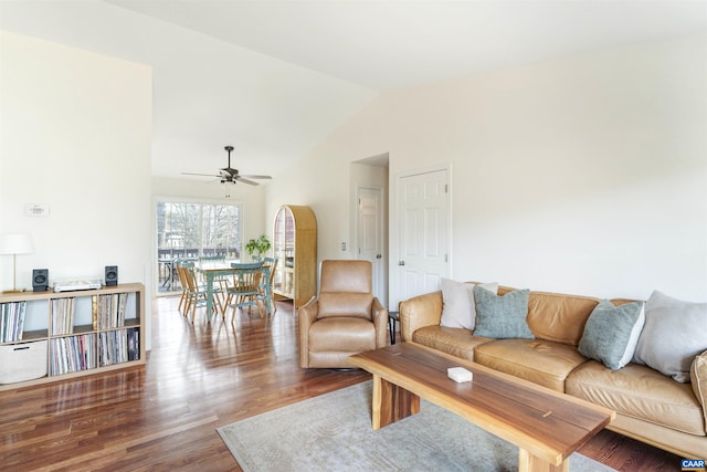 living room featuring lofted ceiling, wood finished floors, and ceiling fan