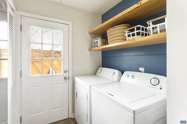 clothes washing area with laundry area and separate washer and dryer