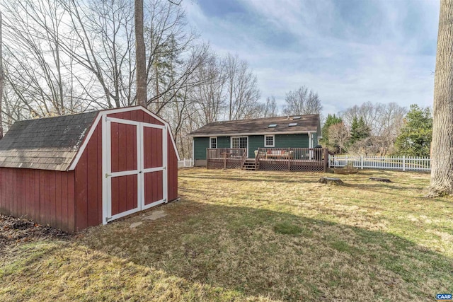 view of shed featuring fence