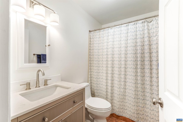 full bath featuring tile patterned floors, curtained shower, toilet, and vanity