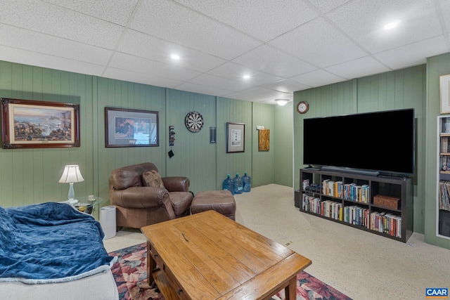 living room with a drop ceiling