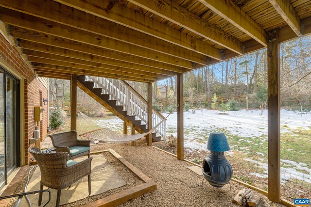 view of snow covered patio