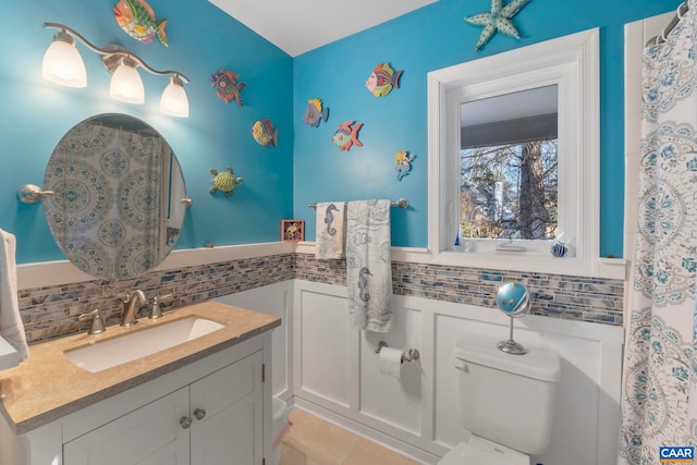 bathroom featuring vanity and toilet