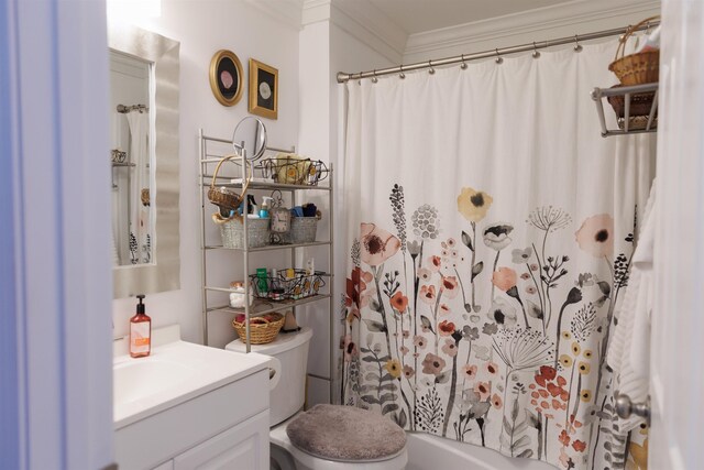 bathroom featuring ornamental molding, toilet, curtained shower, and vanity