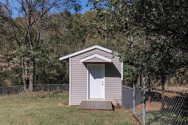 view of outbuilding featuring a yard