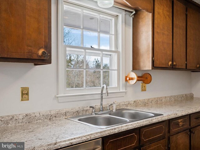 kitchen featuring plenty of natural light and sink