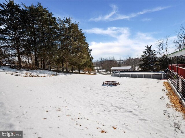 view of yard layered in snow