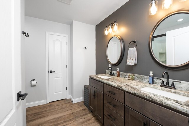 bathroom with wood-type flooring and vanity