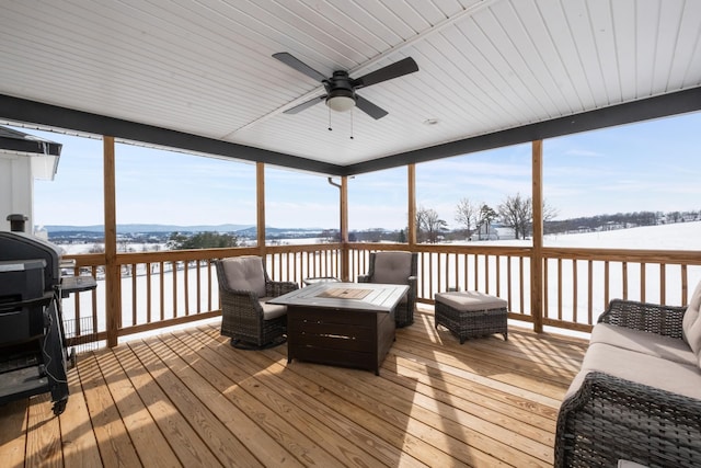 sunroom / solarium with ceiling fan