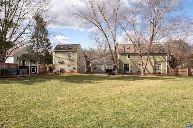 view of yard featuring a deck and fence