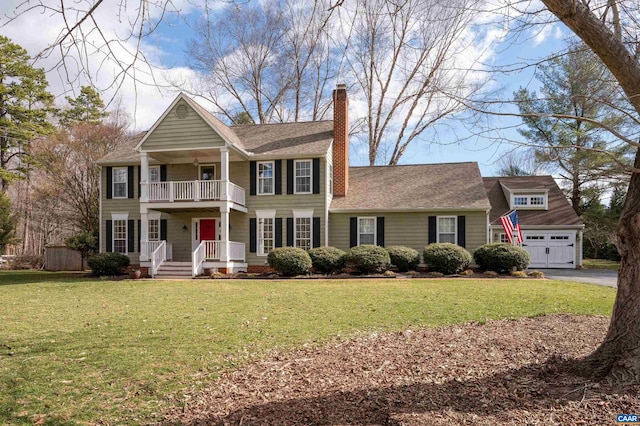 view of front of property with a chimney, an outdoor structure, a balcony, and a front lawn