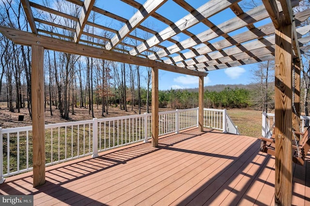 wooden deck featuring a pergola