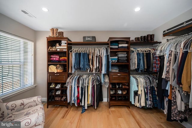 walk in closet featuring wood finished floors and visible vents