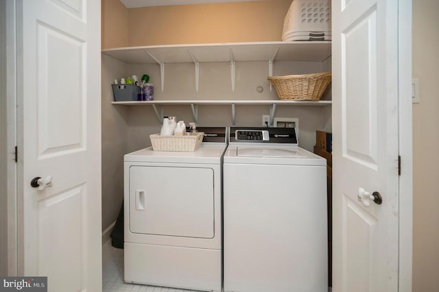 laundry room with independent washer and dryer and laundry area