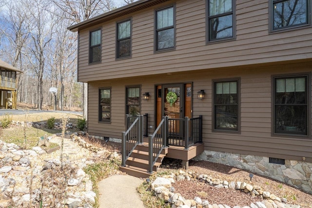 view of front of home featuring crawl space