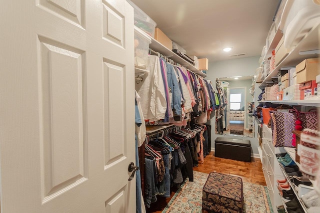 spacious closet featuring visible vents and light wood finished floors