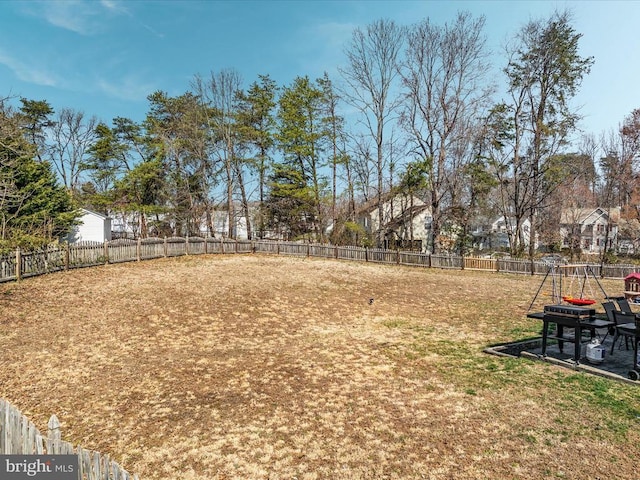 view of yard with a fenced backyard