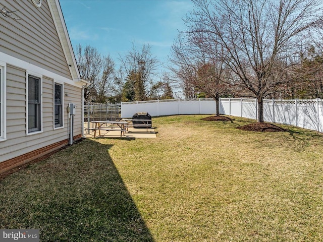 view of yard with a fenced backyard