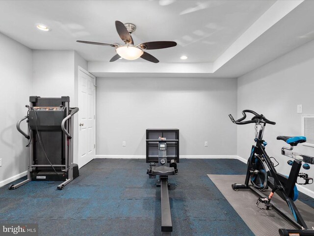 exercise area featuring recessed lighting, a ceiling fan, and baseboards