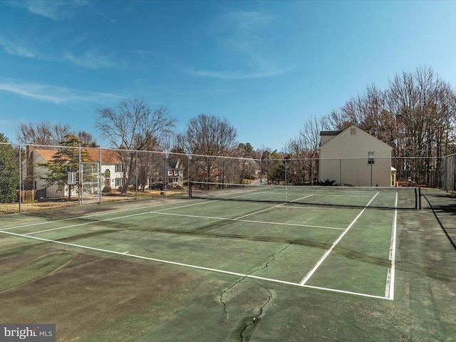 view of sport court with fence