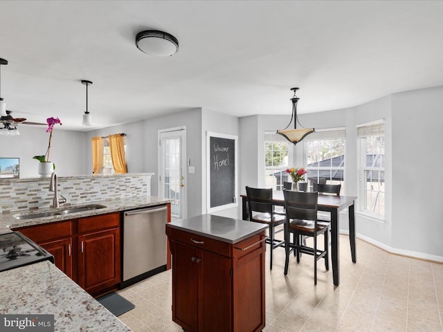 kitchen featuring tasteful backsplash, decorative light fixtures, dishwasher, black electric range, and a sink