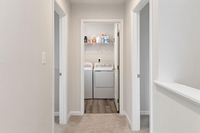 washroom featuring light carpet and washing machine and dryer