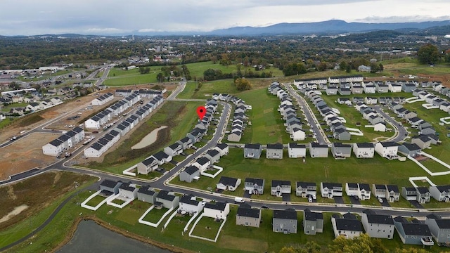 birds eye view of property featuring a mountain view