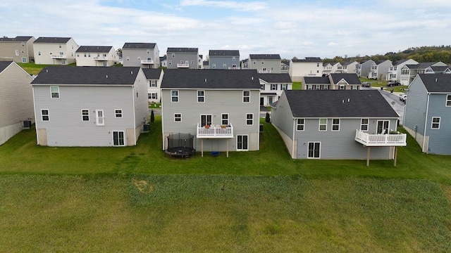 rear view of house with a lawn