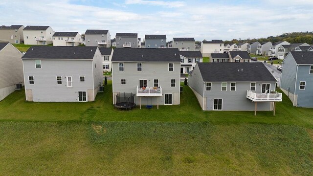 rear view of house with a lawn