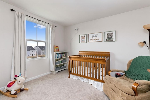 carpeted bedroom with a crib