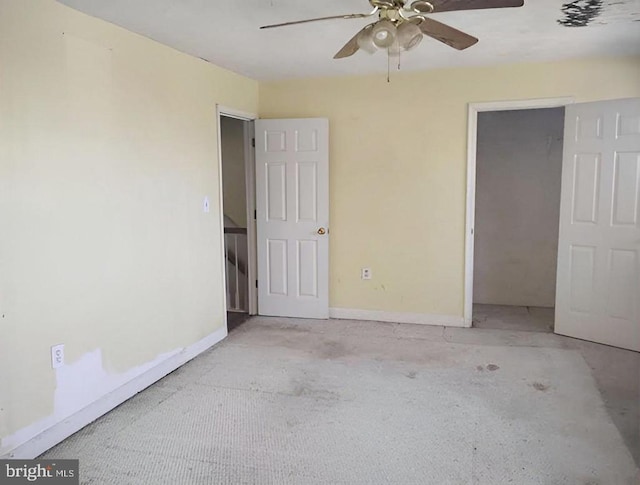 unfurnished bedroom with a closet and ceiling fan