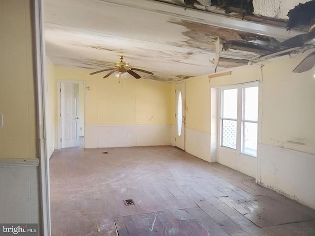 unfurnished room with ceiling fan