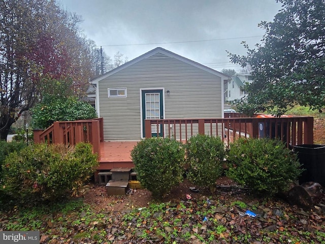 back of house featuring a deck