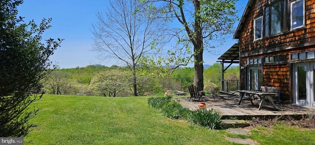 view of yard with a deck