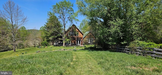 back of property with a yard