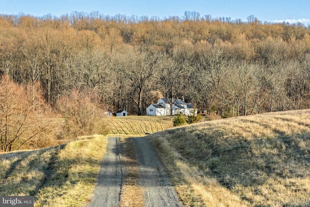 aerial view with a rural view and a view of trees