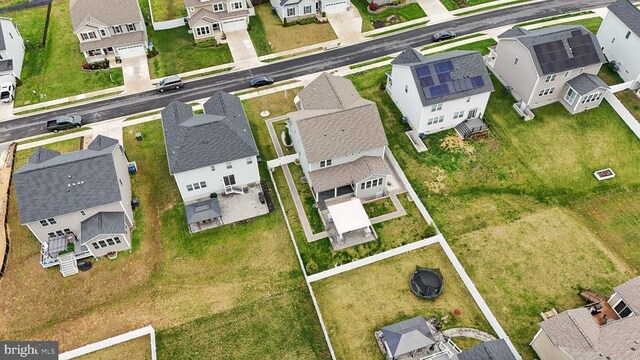 birds eye view of property with a residential view