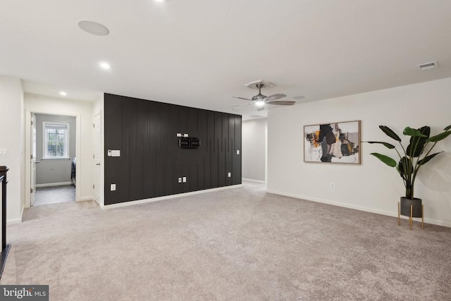 unfurnished living room featuring baseboards, recessed lighting, a ceiling fan, carpet floors, and visible vents