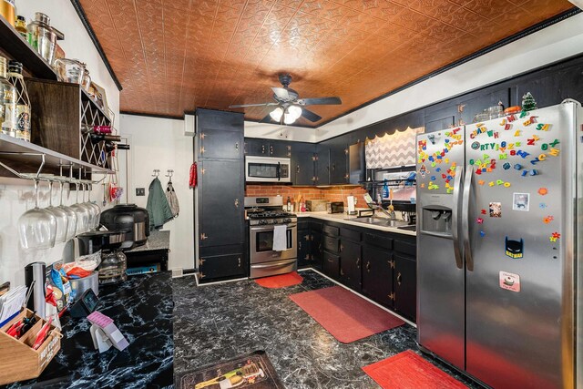 kitchen with an ornate ceiling, a sink, stainless steel appliances, dark cabinetry, and backsplash