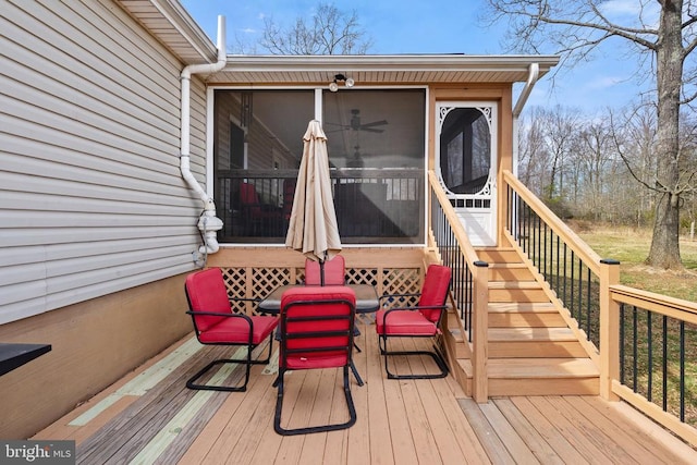 deck with stairway and a sunroom