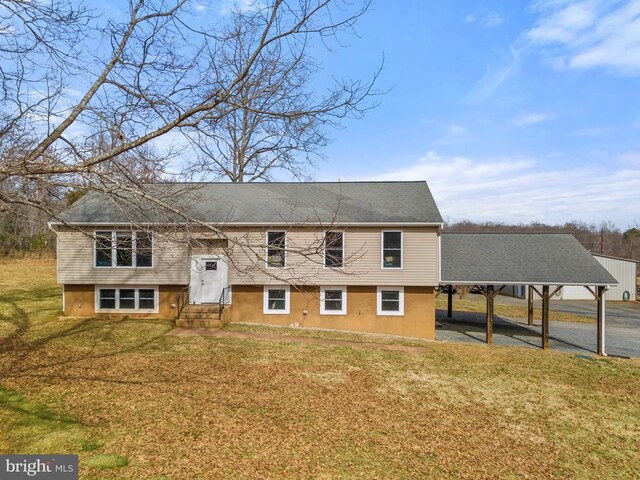 split foyer home with a front lawn and entry steps