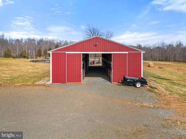 view of pole building with a yard