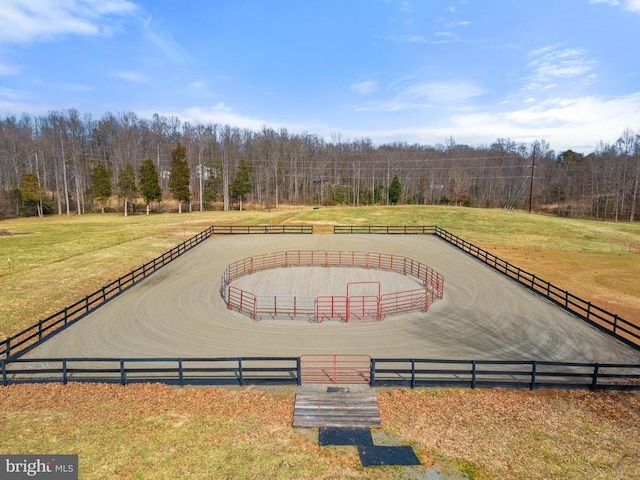 birds eye view of property featuring a wooded view