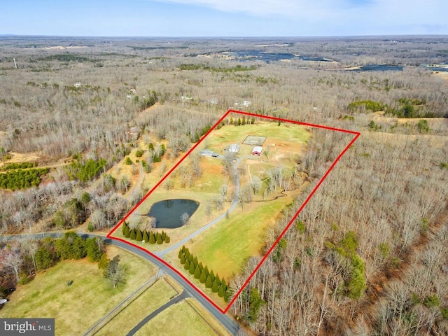 birds eye view of property with a rural view