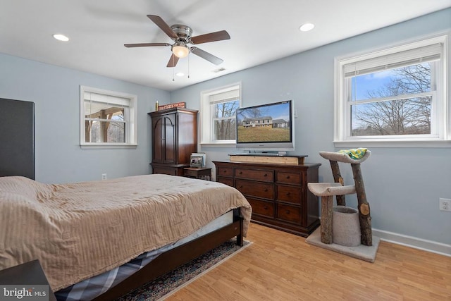 bedroom with a ceiling fan, visible vents, baseboards, recessed lighting, and light wood-type flooring