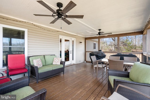 deck featuring outdoor dining area, ceiling fan, outdoor lounge area, and grilling area