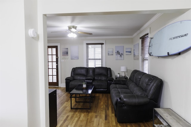 living room featuring crown molding, hardwood / wood-style floors, and ceiling fan