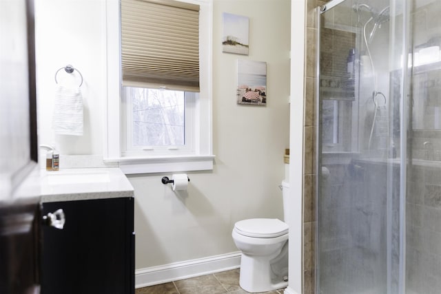 bathroom featuring vanity, an enclosed shower, tile patterned floors, and toilet